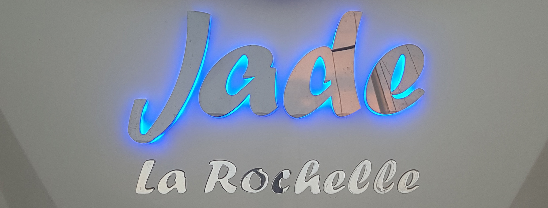 Embossed stainless steel letters with blue LED lighting
